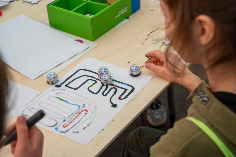 Children play with the Ozobots.