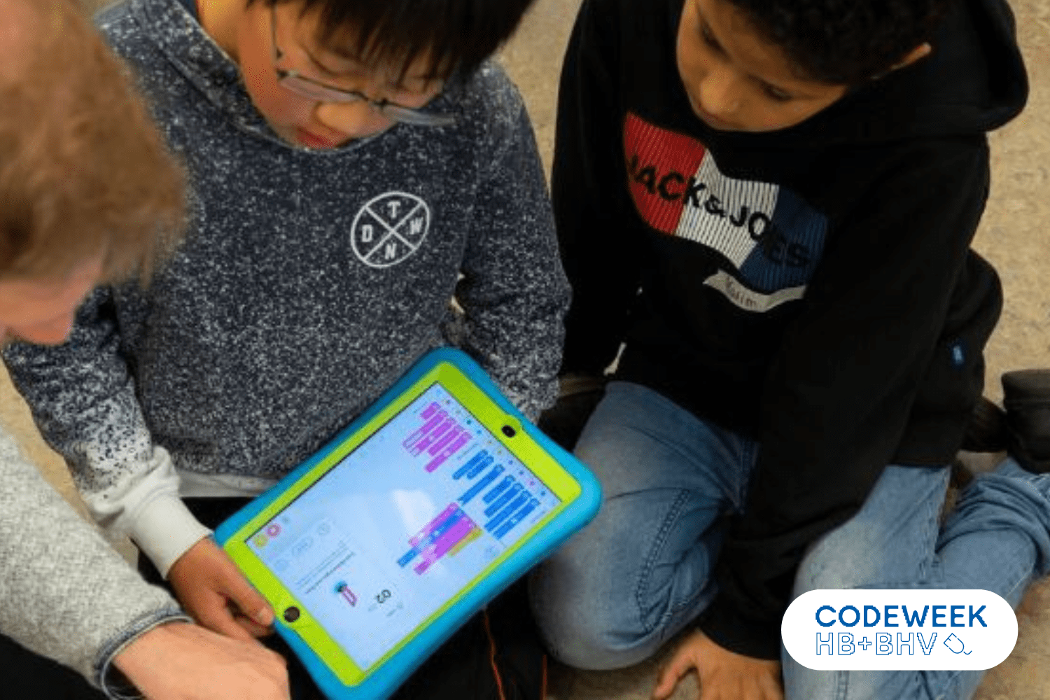 Children program using Scratch on a tablet